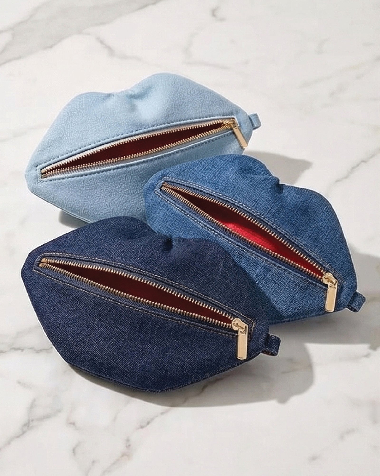 The Blake — Light Blu Denim Lip Pouch — lip-shaped makeup pouch by David Stesner ArtHouse — angle view